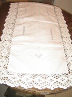 Hand-embroidered white tablecloth runner with a beautiful hand-crochet edge