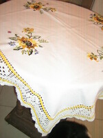 Beautiful hand-embroidered tablecloth with a hand-crocheted edge