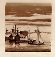 Brown colored old Dutch glazed ceramic earthenware decorative tile marked lakeside landscape windmill sailing