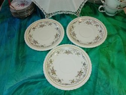 Richly patterned cookie plates...Butter color base.
