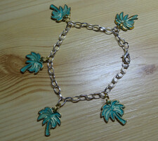 Bracelet on a silver-colored chain with gold and turquoise palm tree, showy, the palm has 2 sides.