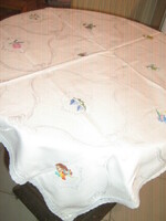 Beautiful hand-embroidered damask tablecloth with a lace edge