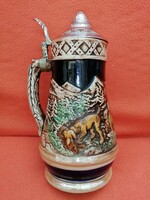 Musical jug with a lid.