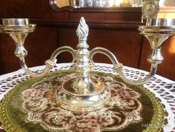 Elegant, silver-plated, vintage, dotted, two-pronged candlestick to enhance the festive atmosphere