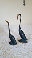 A pair of painted, patinated, stylized Indian copper swans