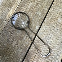 Old magnifier with copper handle