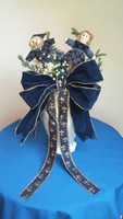 Christmas table decoration with dolls, artificial flowers, blue and gold bourbon lily ribbon