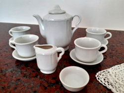 Old toy porcelain tea set with crochet small tablecloth