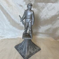 Large metal worker guard statue