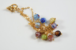 Gold necklace with Murano balls. New