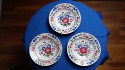 Three floral granite ceramic wall plates
