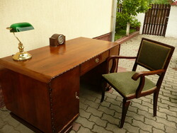 Antique, art deco desk that can be placed in a space, with a built-in bookshelf at the back and its own chair together