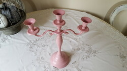 Pink, three-pronged metal candle holder