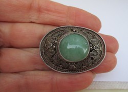 A wonderful antique silver brooch with a large jade stone