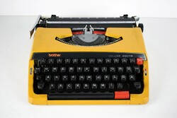 Retro mid century brother typewriter / 70s / yellow / metal
