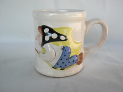 Ceramic mug with a witch on a broomstick