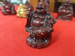 Religious laughing Buddha plastic statue.