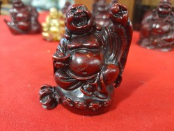 Religious laughing Buddha plastic figural statue.