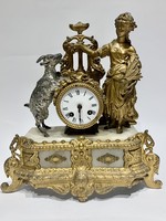 French Empire fire-gilt table clock with a girl and a goat