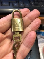 Louis vuitton copper padlock from the 20s with two original keys.