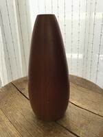 Old modern wooden vase with glass tube inside