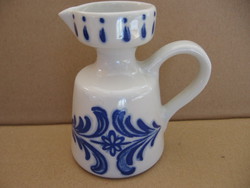 Small numbered shabby jug in vase