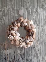 Door wreath made of shells, zen riverside gravel pearl shell snail shell
