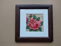 Tapestry depicting a rose in a modern frame