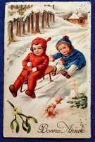 Art deco Újévi üdvözlő litho képeslap erdőben szánkózó gyerekek  fagyöngy