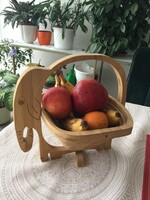 A wooden folding tray in the shape of an elephant can also be used to store fruit or anything