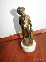 Shoeing little boy - bronze statue on a marble base