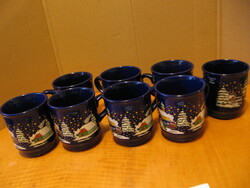 Dark blue Mäser mugs with a snowman and a Christmas landscape