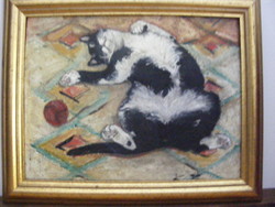 Cica macska  gombolyaggal labdával játszik torontáli szőnyegen  olaj