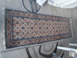 Old thick hand-knotted oriental wool rug in good condition