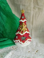 Porcelain candlestick with red Christmas tree candle.