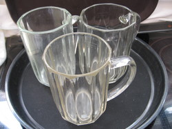 Antique, calibrated 0.5 l jugs polished on a plate