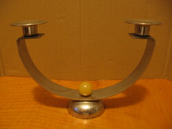 Retro art deco loft design. Protected, chrome-plated two-pronged candle holder
