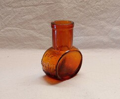 Antique small brown beef extract bottle from the 1930s.