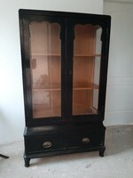 A special, beautifully shaped display cabinet with two drawers at the bottom