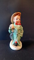 Ceramic craftsman figure. A boy with a hat and a cane.