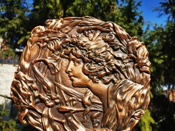 Art Nouveau female head, relief