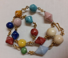 Old retro necklace made of glazed porcelain beads in beautiful colors