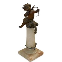 Antique angel statue on an alabaster pedestal