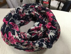 A young, flower-patterned round scarf