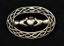 Pierced silver brooch with 