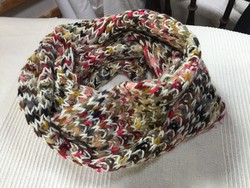 Young, loosely knit colored round scarf
