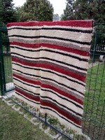 A woolen bedspread or wall protector