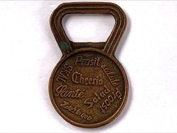 Copper beer opener, written in several languages: for your health