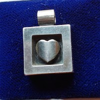 Beautiful silver pendant with a heart motif