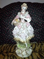 Beautiful vintage German porcelain fruit girl decorated with frills. Flawless. 44 cm high